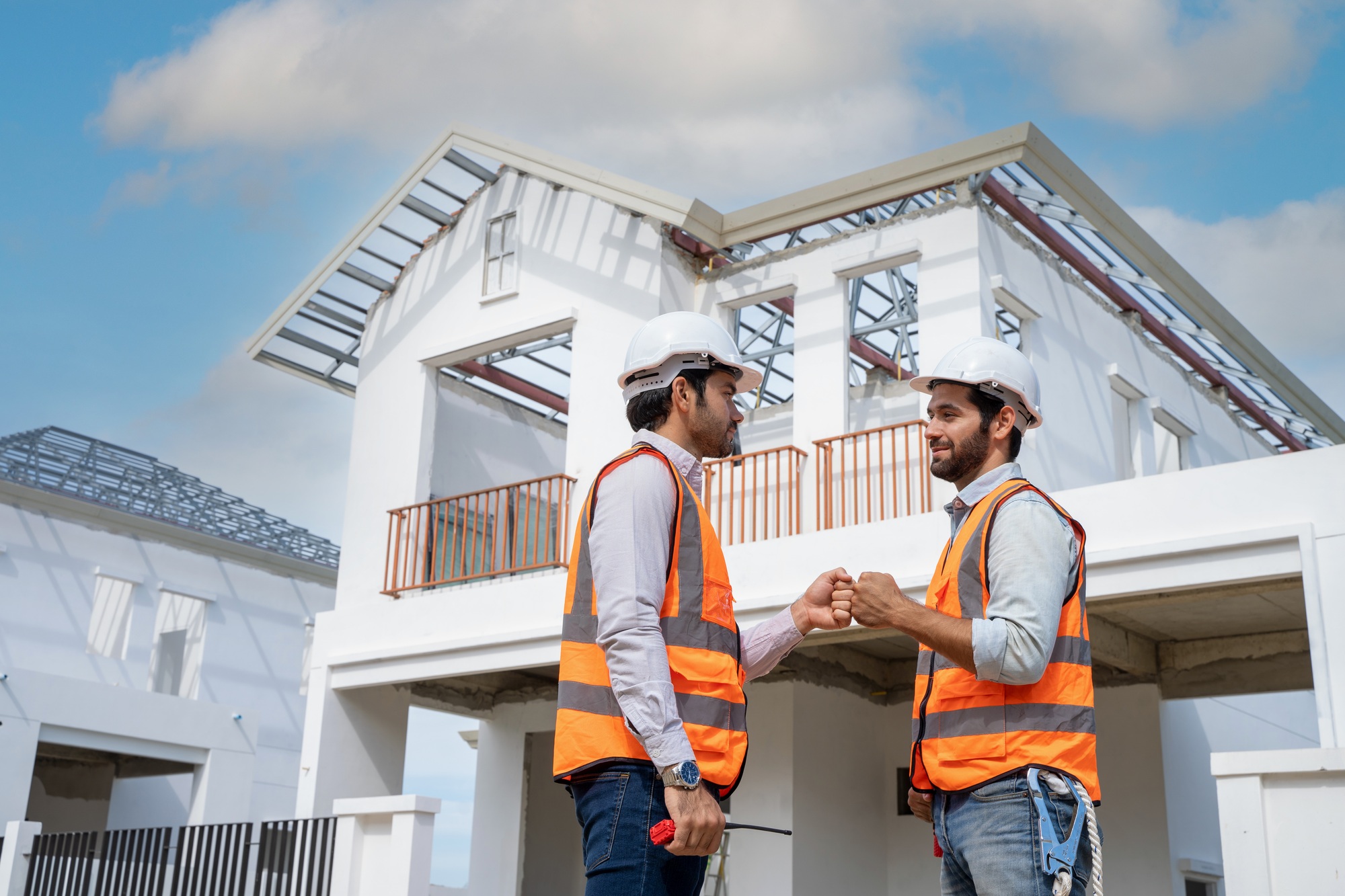 Architect shaking hands engineer team builder in renovation site.
