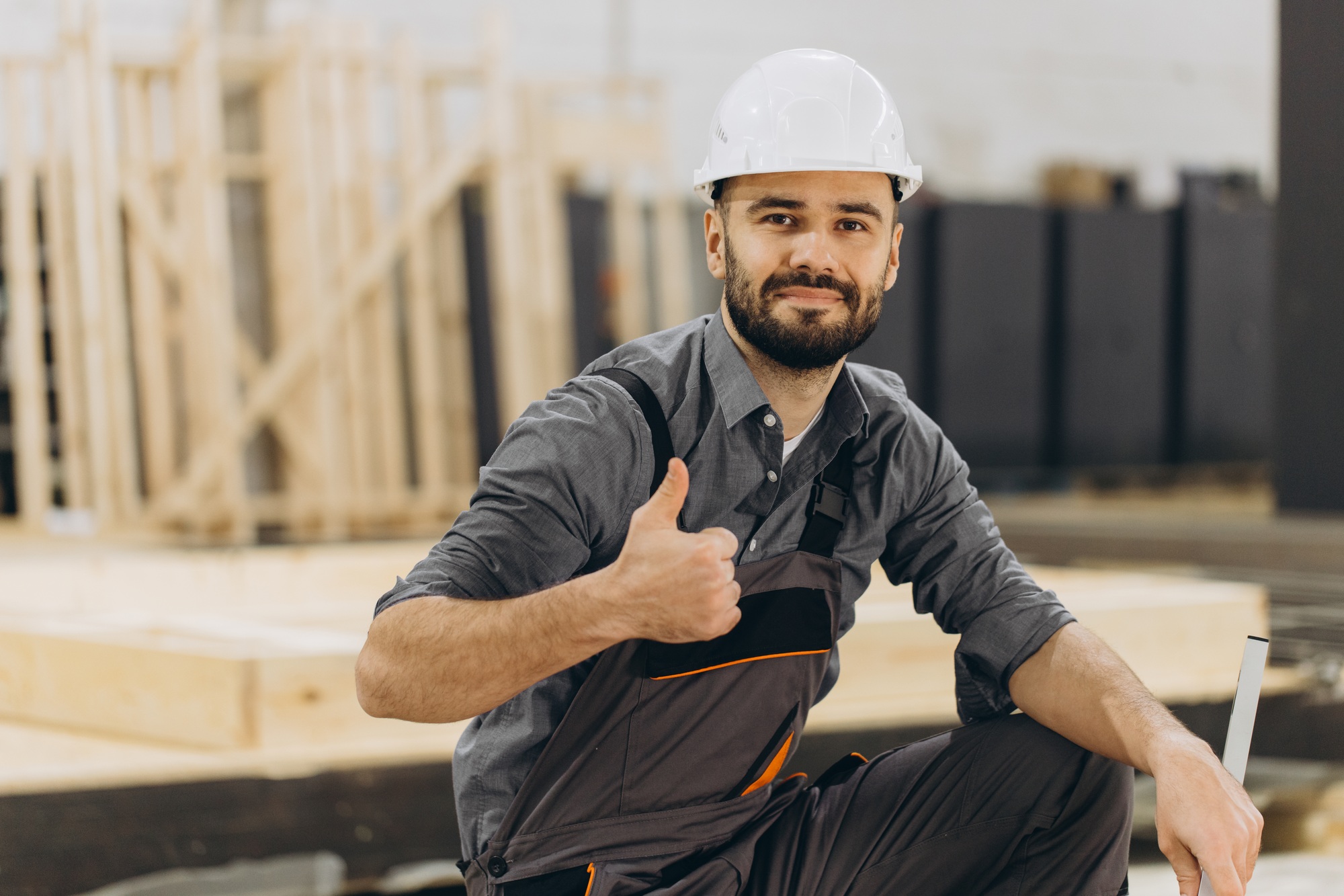 Construction worker gesturing thumbs up in modular building industry