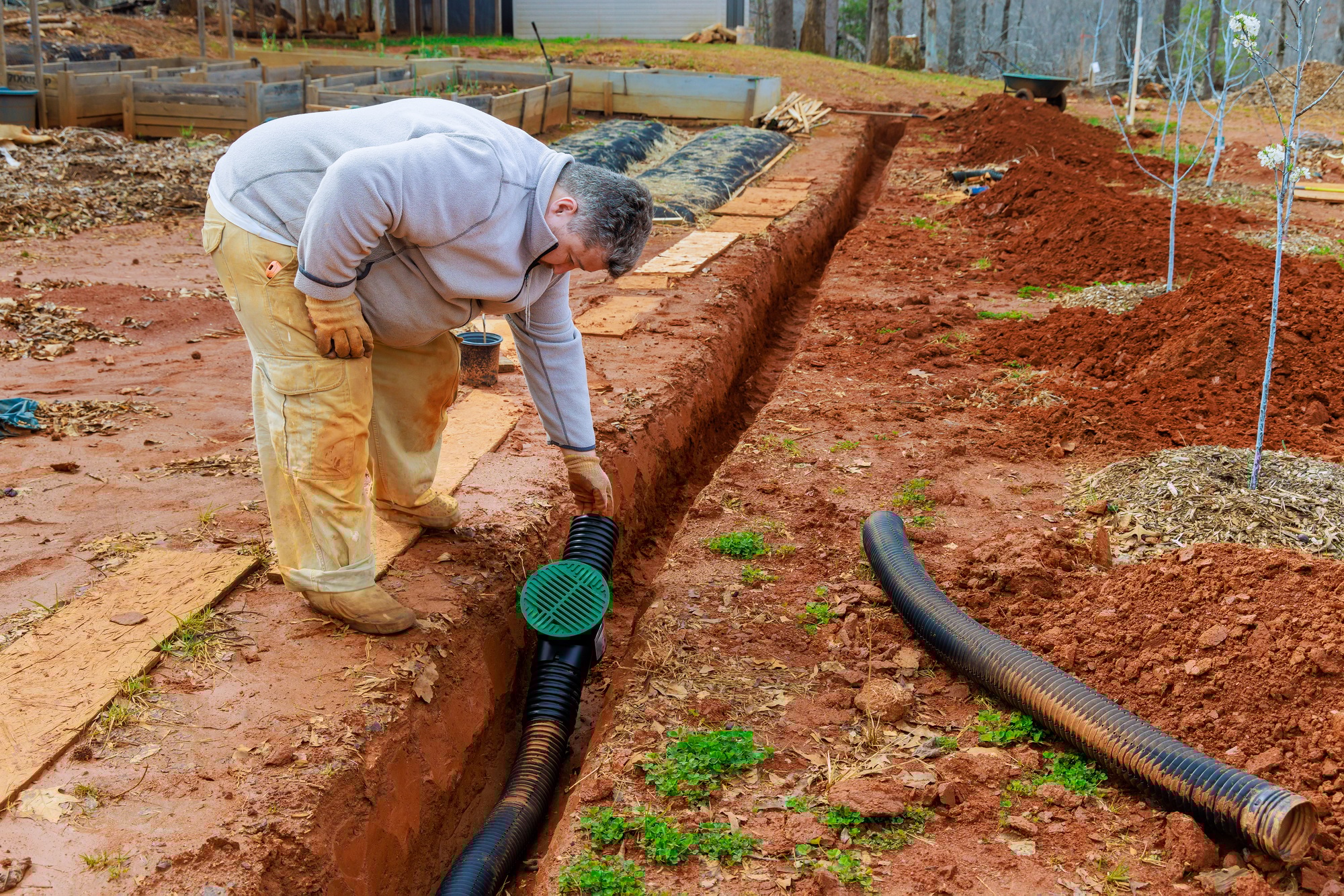 Drain pipe for storm drainage is installed in a trench drain for draining rainwater