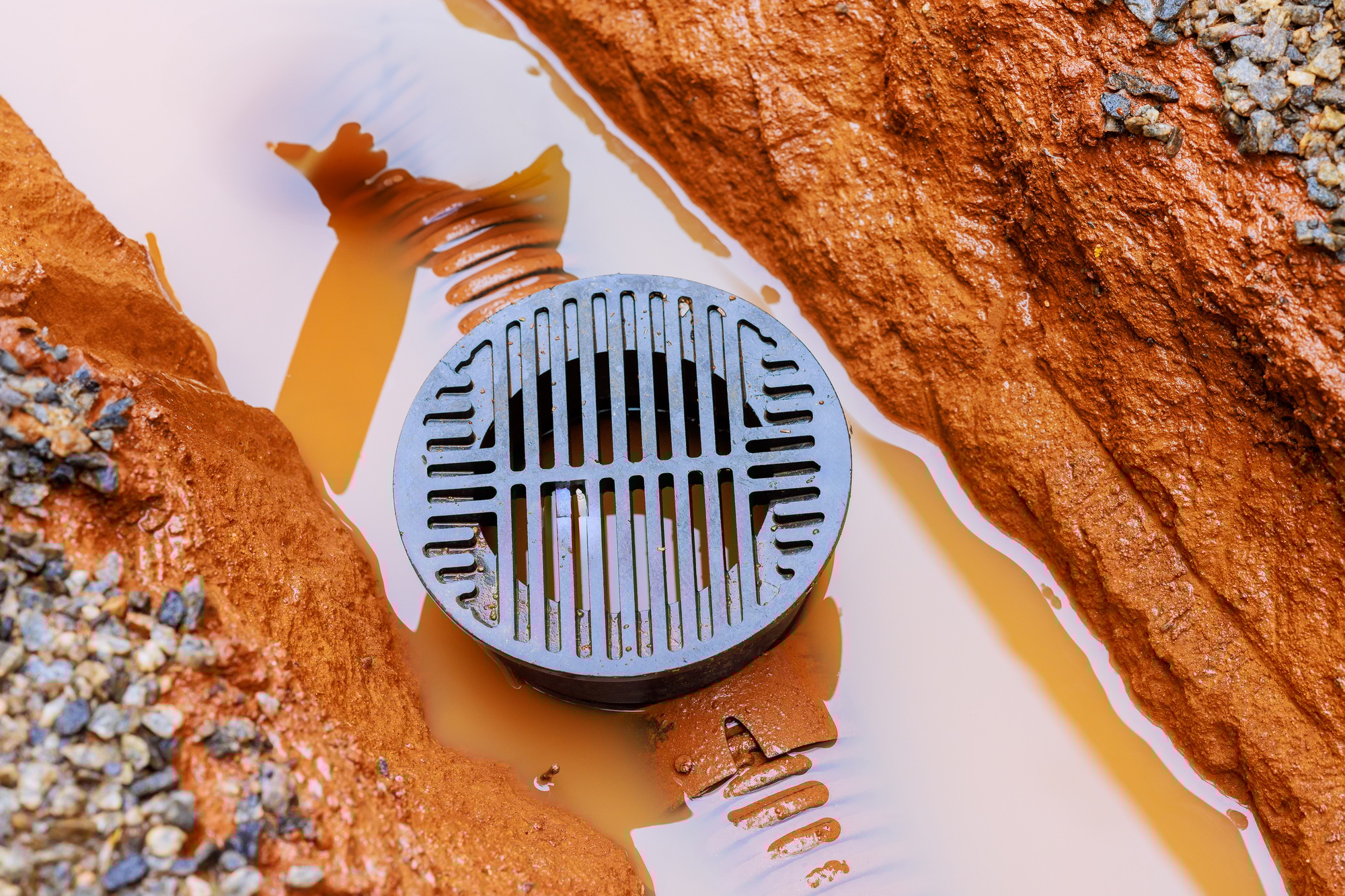 It is common for drainage trenches to flood with water during heavy rains for communication a cables
