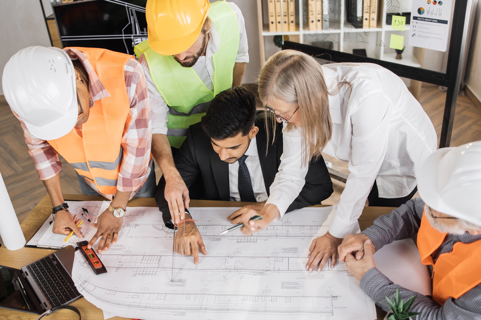 Qualified construction team planning arrangement of service lines of new building.